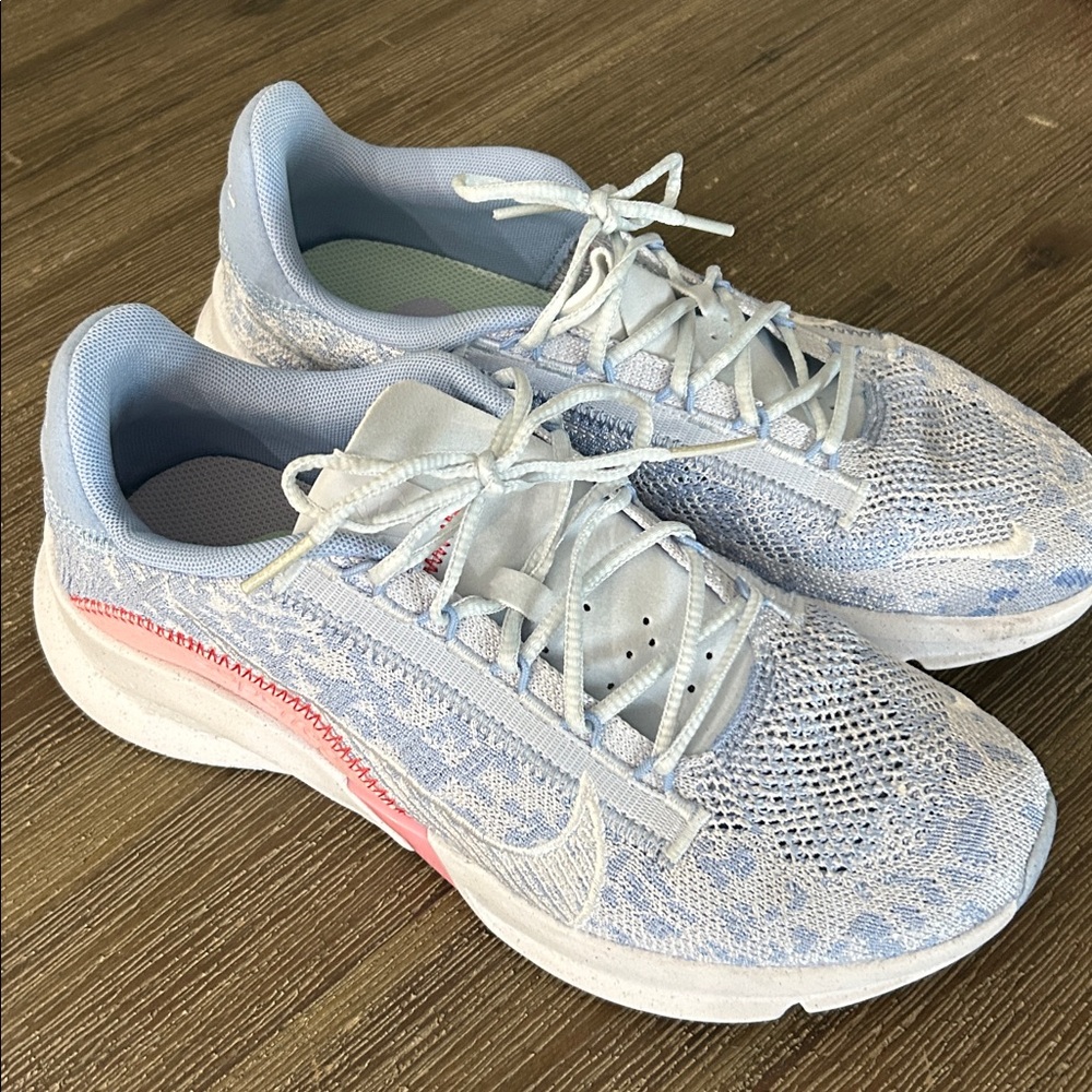 Nike Women's Light Blue and White Running Sneakers with Pink Accent